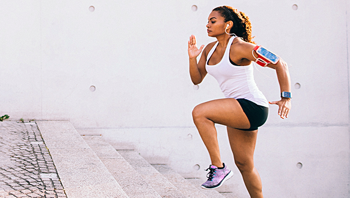 A woman running up the steps as exercise A woman running up the steps as exercise